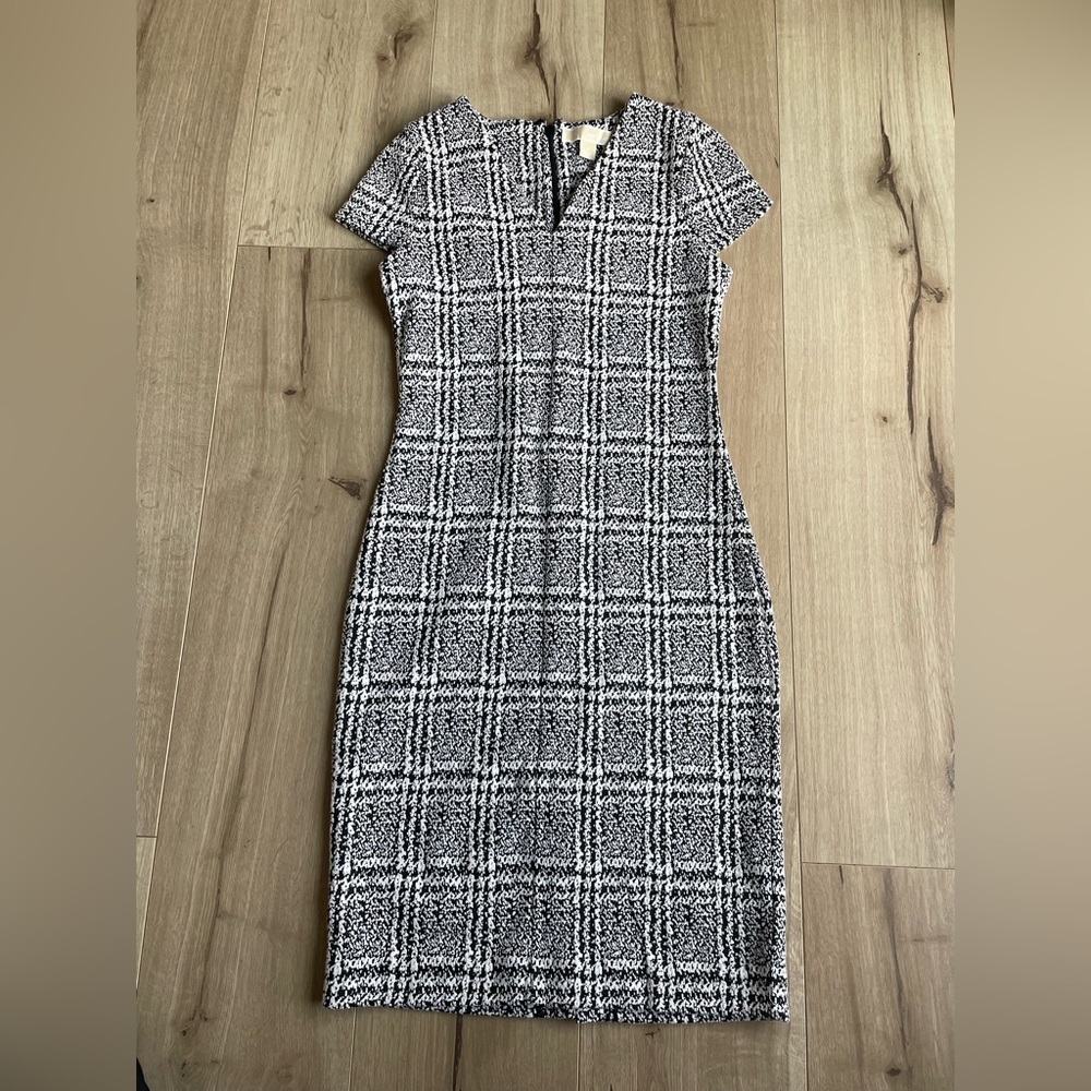 Calvin Klein, brand new. Back slit not cut